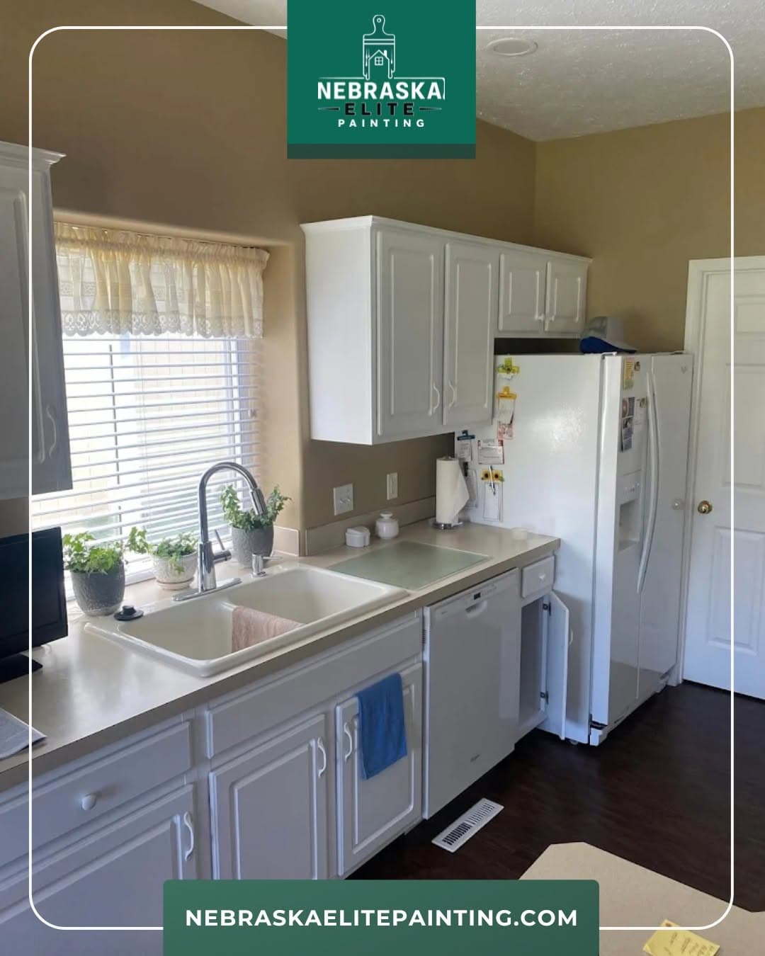 Modern kitchen with white cabinetry, stainless steel appliances, and natural light.