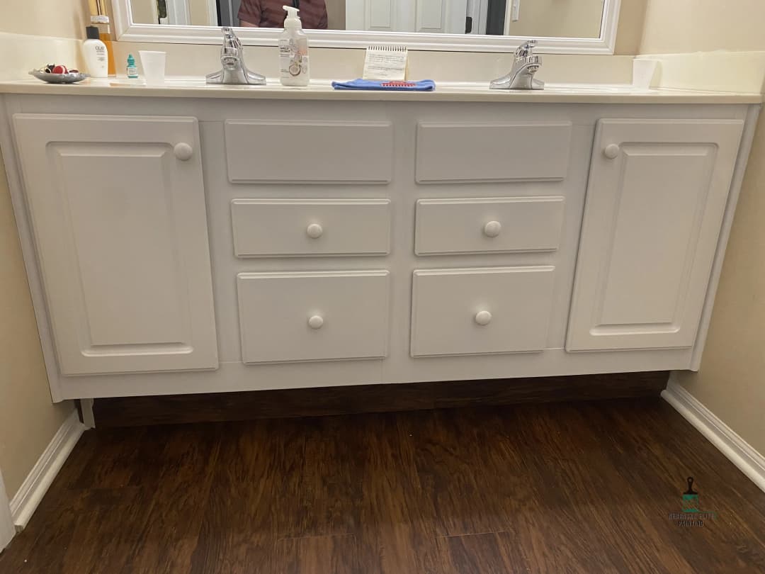 Modern bathroom vanity with six drawers and dual sinks on a wooden floor.