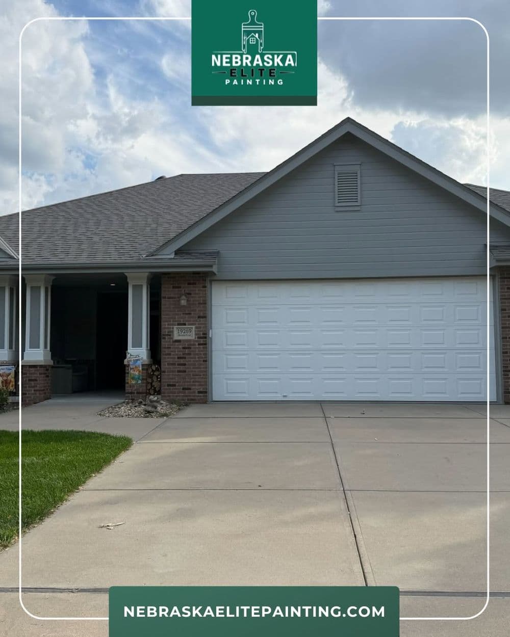 House exterior in Nebraska with fresh paint, green lawn, and clear skies. Nebraska Elite Painting.