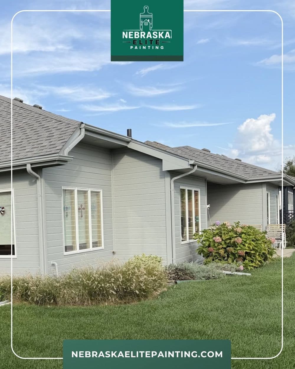 Gray house exterior with fresh paint and landscaped garden by Nebraska Elite Painting.