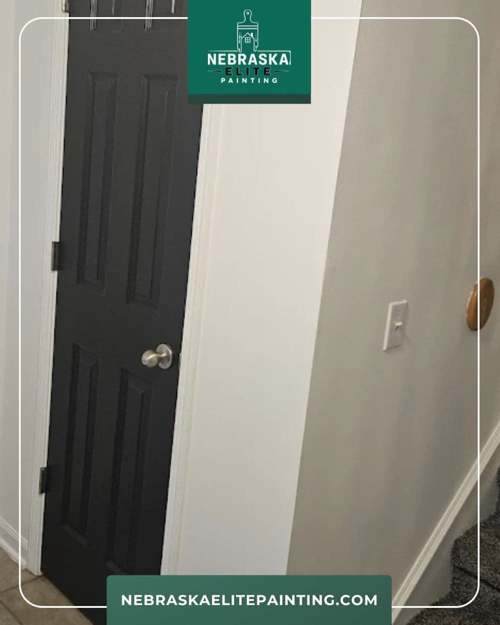 Black door with silver handle in a hallway, showcasing Nebraska Elite Painting's quality work.