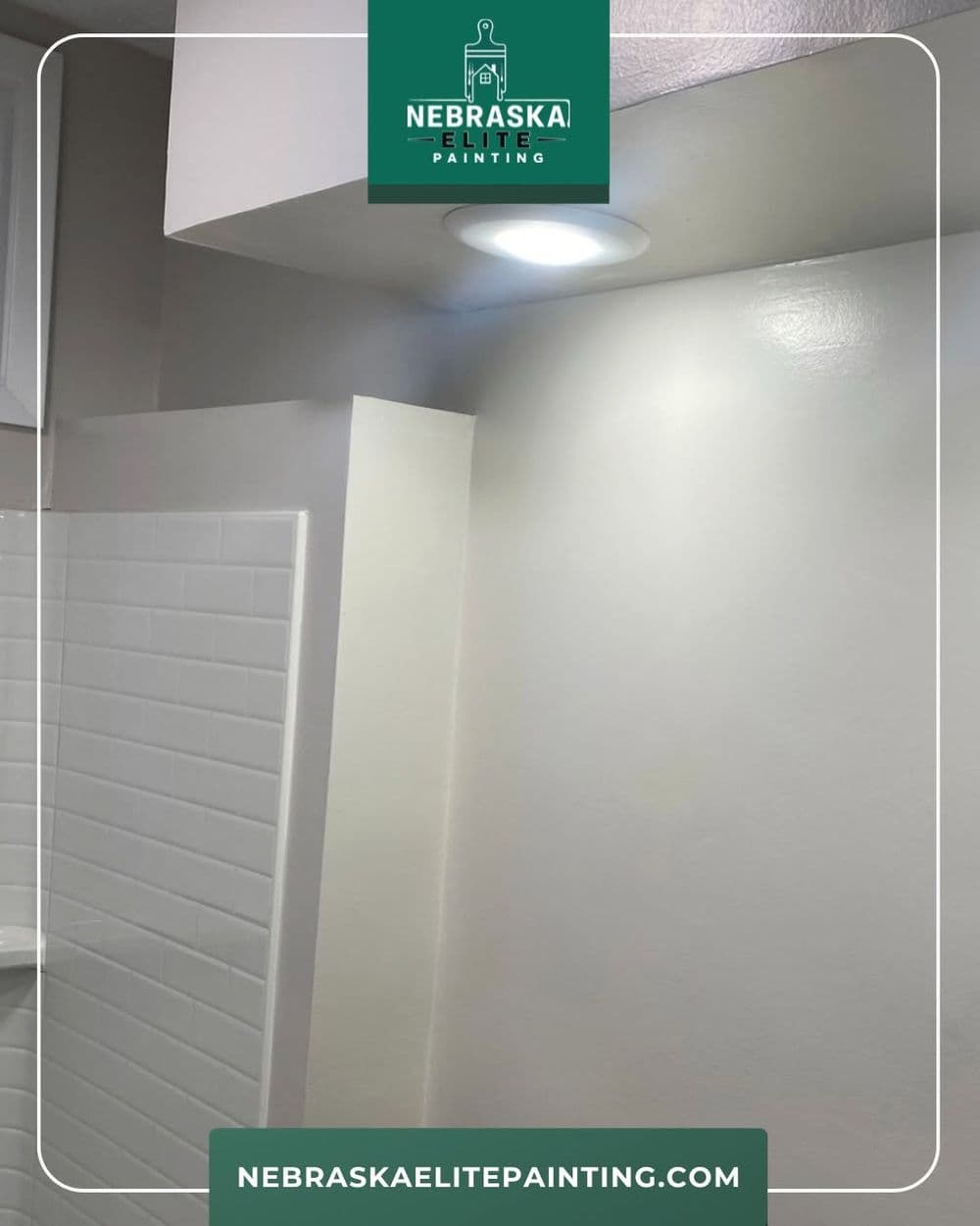 Brightly lit bathroom corner featuring freshly painted walls and modern tiles. Nebraska Elite Painting.