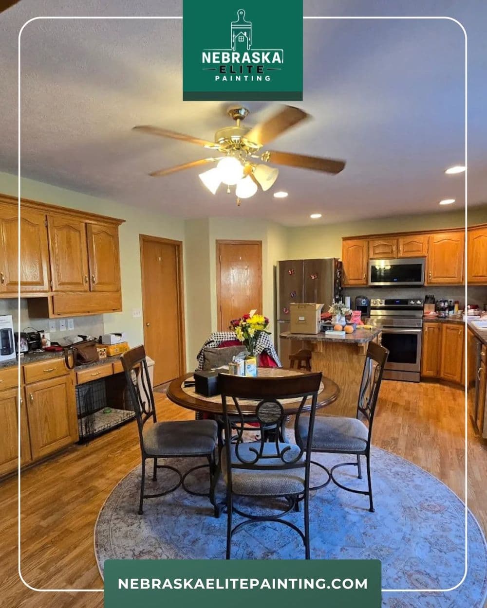 Modern kitchen with wooden cabinets, dining table, and vibrant flower centerpiece.